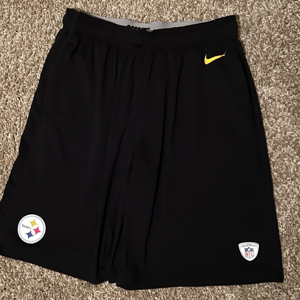 Black Nike shorts with Steelers and Nike logos
